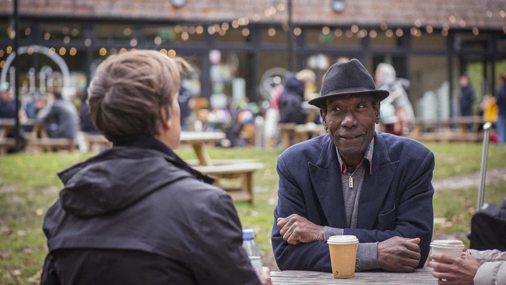 Two older people having a conversation