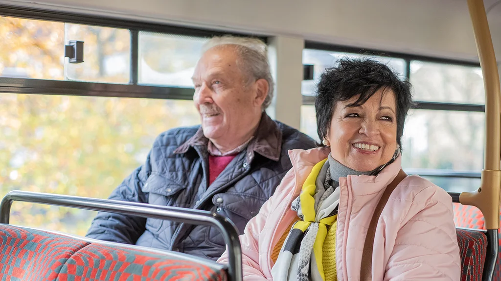 An older couple on a bus