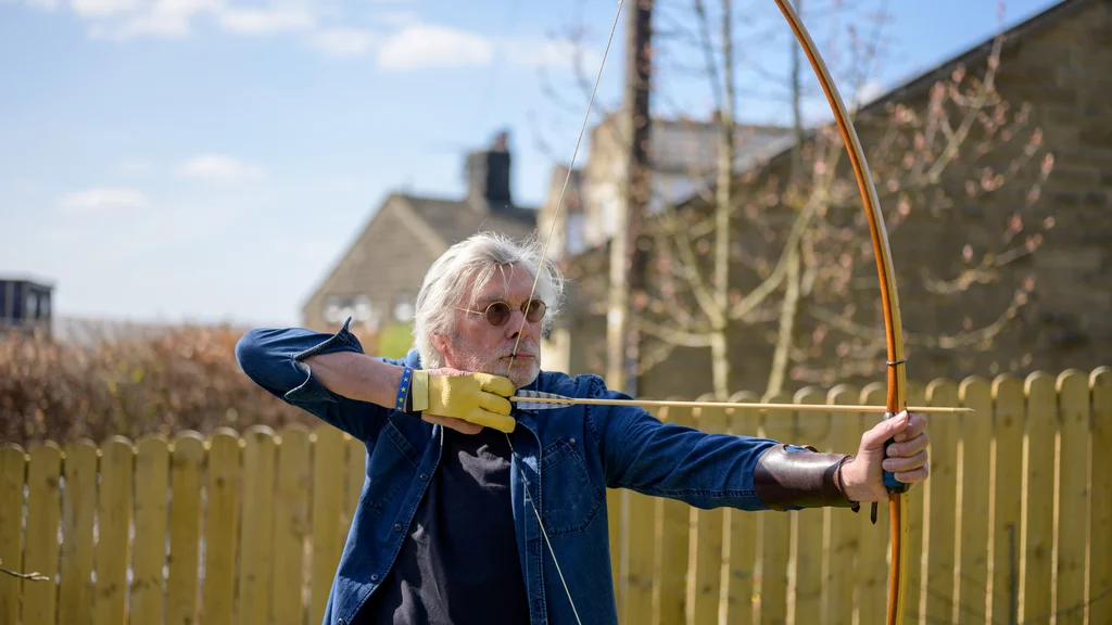 Older man doing archery