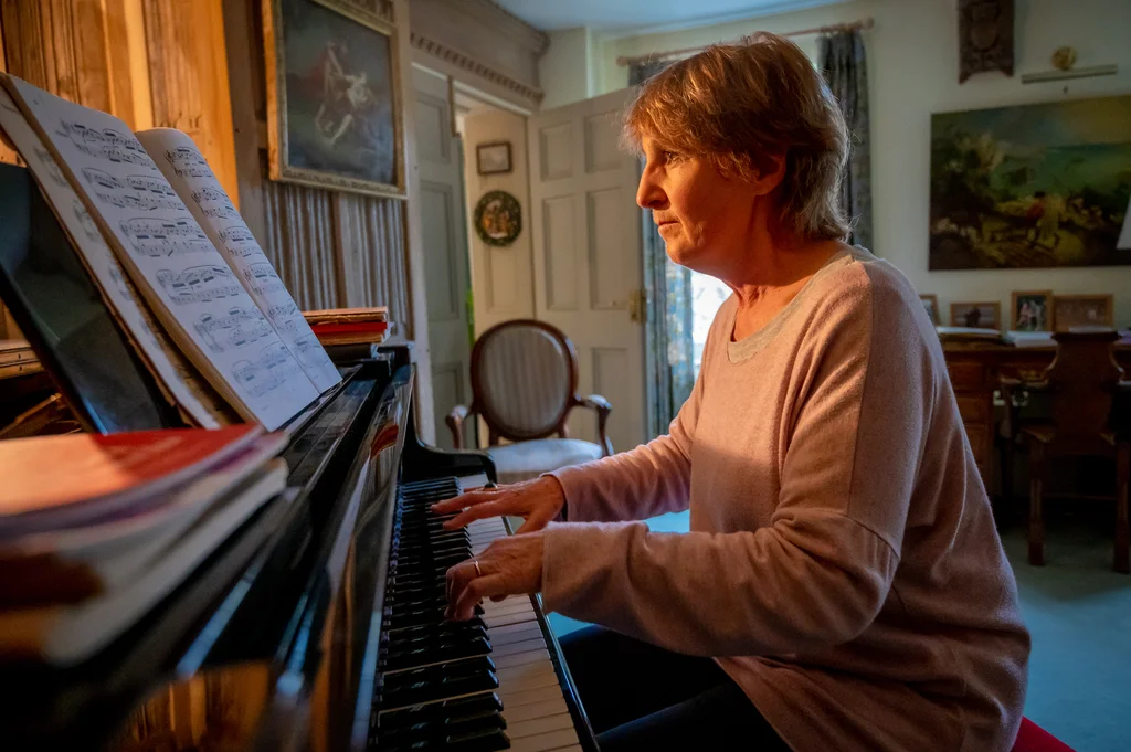 Older woman playing piano